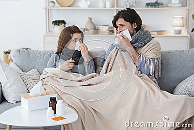 Sick family suffering from cold at home Stock Photo