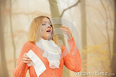 sick-ill-woman-autumn-park-sneezing-tiss