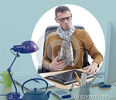 Sick independent man suffering from painful stomach ache at office Stock Photo