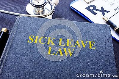 Sick Leave Law book and the stethoscope. Stock Photo