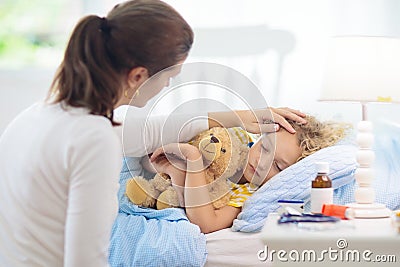 Sick little boy with asthma medicine. Ill child Stock Photo