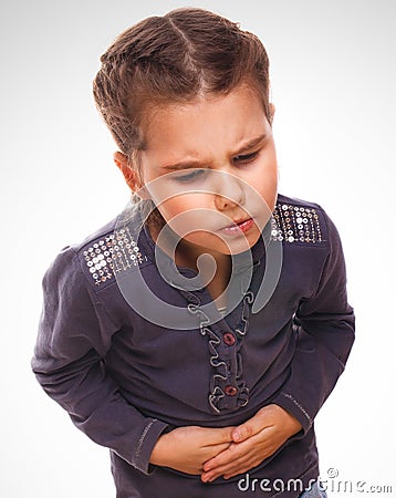 Sick little child girl pain in the stomach, belly Stock Photo