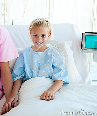 Sick little girl on a hospital bed Stock Photo