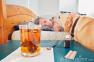 Sick man in bed Stock Photo
