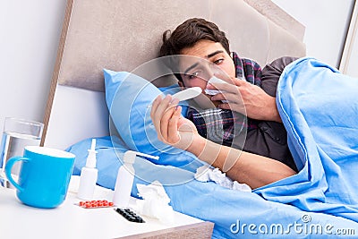 The sick man with flu lying in the bed Stock Photo