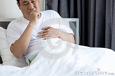 Sick middle aged man have a sore throat and chronic cough from Pneumonia or Bronchitis,male experience chest pain,persistent cough Stock Photo