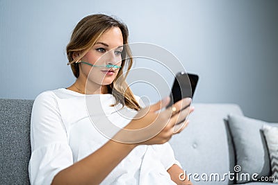 Sick Patient With Nasal Cannula. Ill Woman Stock Photo