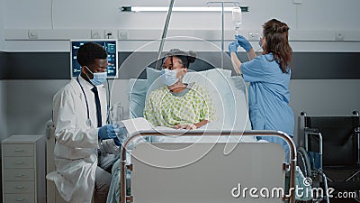 Sick patient receiving medical assistance from medic Stock Photo