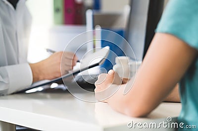 Sick patient visiting doctor in health care center or emergency room. Stock Photo