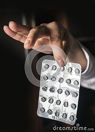 Sick person holding blister of empty pills, Stock Photo