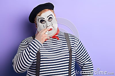 Sick poor man treating his nose, isolated blue background Stock Photo