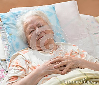 Sick senior woman Stock Photo