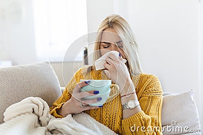 Sick Woman.Flu.Woman Caught Cold. Sneezing into Tissue. Headache. Virus .Medicines. Young Woman Infected With Cold Blowing Her Stock Photo