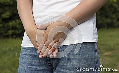 Sick woman with hands holding pressing her crotch lower abdomen. Medical or gynecological problems, healthcare concept Stock Photo