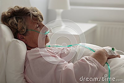 Sick woman with nasal cannula Stock Photo