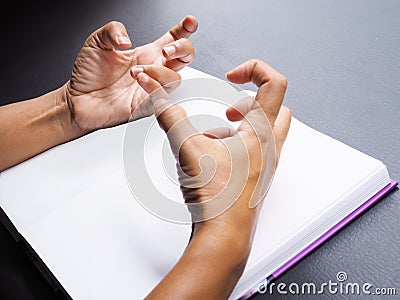 Hands with convulsions and muscle spasms, seizure disorder Stock Photo