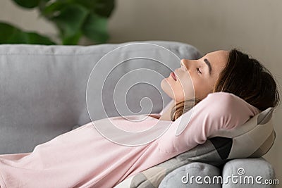 Side close up view woman having day nap on couch Stock Photo