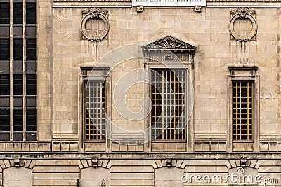 Side of decorative vintage block building with relief sculptures Stock Photo