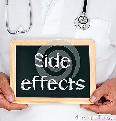 Side effects - Doctor holding chalkboard with text Stock Photo