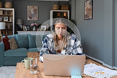 Side hustle money, second job concept. Young university student woman working freelance internet online job to pay student loan, Stock Photo