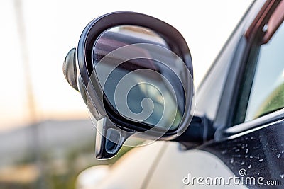 Side mirror of a vehicle with a secondary blind spot assistance mirror closeup with selective focus Stock Photo