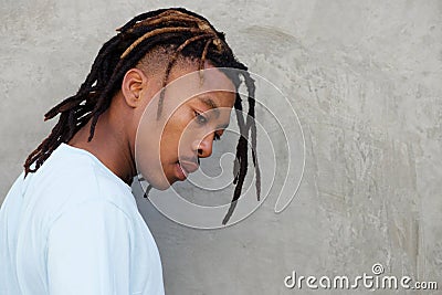 Side portrait of african man with dreadlocks in contemplation Stock Photo