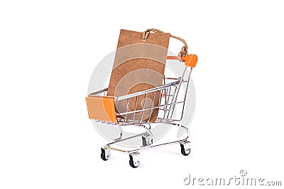 Side profile close up photo of small push card with pricetag inside in the metallic with orange color trolley isolated on white br Stock Photo