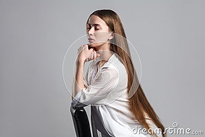 Side profile view of calm beautiful young model actor with long Stock Photo