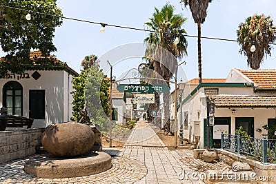 Side quiet street with stone pavement in Zikhron Yaakov city in northern Israel Editorial Stock Photo
