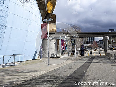 Seattle, WA USA - circa March 2022: Side street view of pedestrian traffic near the Museum of Pop Culture on an overcast day Editorial Stock Photo