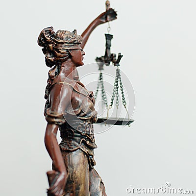 Side of themis, femida or justice goddess sculpture on white Stock Photo