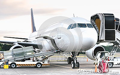 Side view of airplane at airport terminal gate - Emergency travel concept with international flights canceled due to worlwide Stock Photo