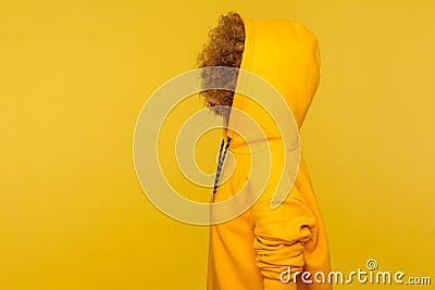 Side view of anonymous person with thick curly hair wearing urban style hoodie, sportive fashion clothe Stock Photo