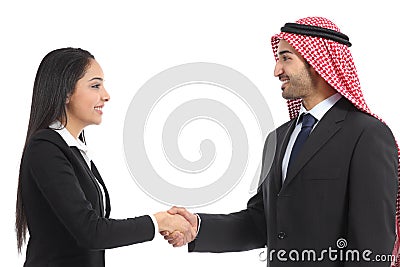 Side view of an arab saudi businesspeople handshaking Stock Photo