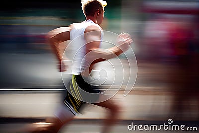 Side view of athletic runner with motion blur on city street Stock Photo