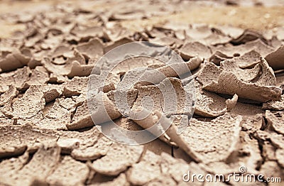 Side view of natural background with texture of earth and sand covered cracks and detached parts from the drought Stock Photo