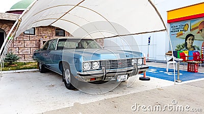 Side view of a blue Cadillac Eldorado under the canopy. careful storage of a vintage car. car show outdoor. restoration Editorial Stock Photo