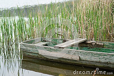 Side view of a boat in water with reflection Stock Photo