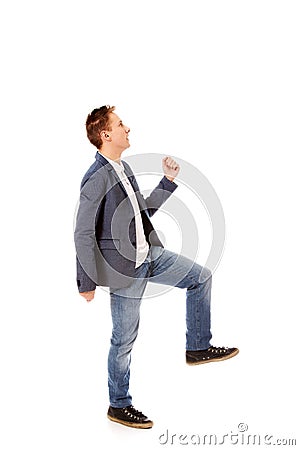 Side view of a businessman climbs the stairs Stock Photo