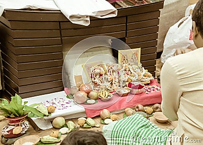 Side view of a businessman doing Diwali Lakshmi Ganesha Puja vidhi rituals at Dhanteres time at home. Lakshmi is Hindu goddess Stock Photo