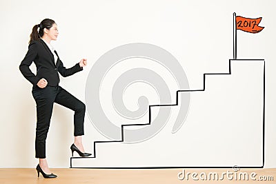 Side view of businesswoman climbing the stairs of drawing Stock Photo