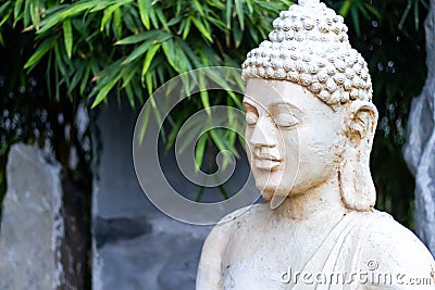 Side view close-up shot of a buddha statue. Buddhism and religion concept Stock Photo