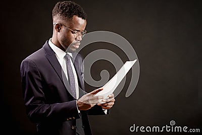 Successful worker reading papers in the office Stock Photo