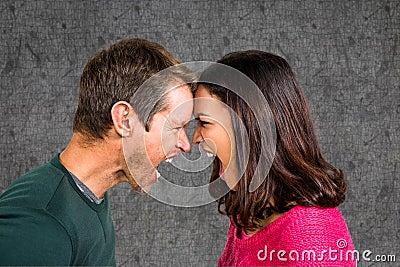 Side view of couple shouting while fighting against gray background Stock Photo