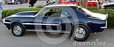 Side view of dark blue antique Chevy Camaro Editorial Stock Photo