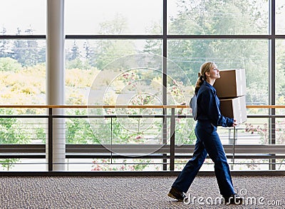 Side view of delivery woman in uniform Stock Photo