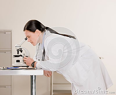 Side view of doctor examining specimen Stock Photo