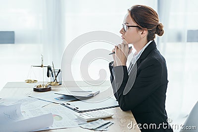 side view of financier sitting at table Stock Photo