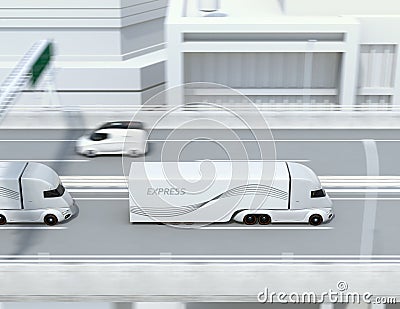 Side view of a fleet of self-driving electric semi trucks driving on highway Stock Photo