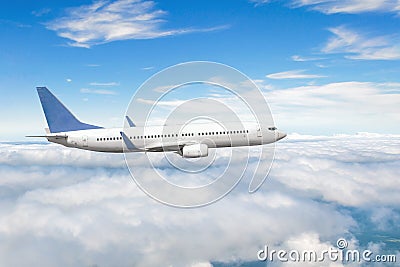 Side view of a flying passenger plane on clouds Stock Photo